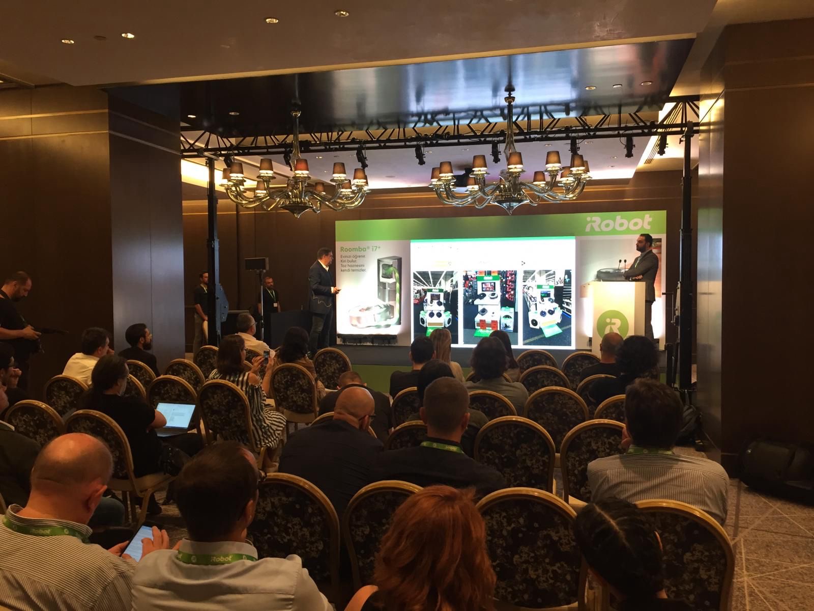 Corporate conference with stage, screen and audience