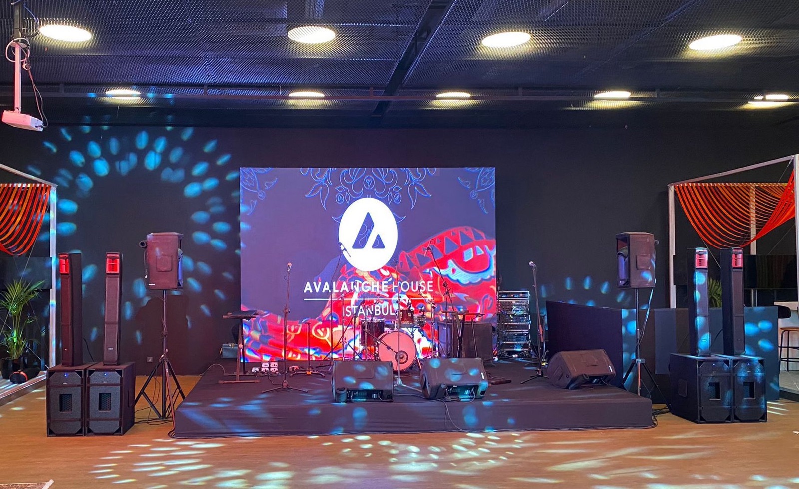 Corporate event stage with LED wall and sound system